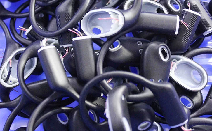 What Is The Production Process Of Liquid Silicone Wrapped Memory Wire In Bluetooth Earphones?